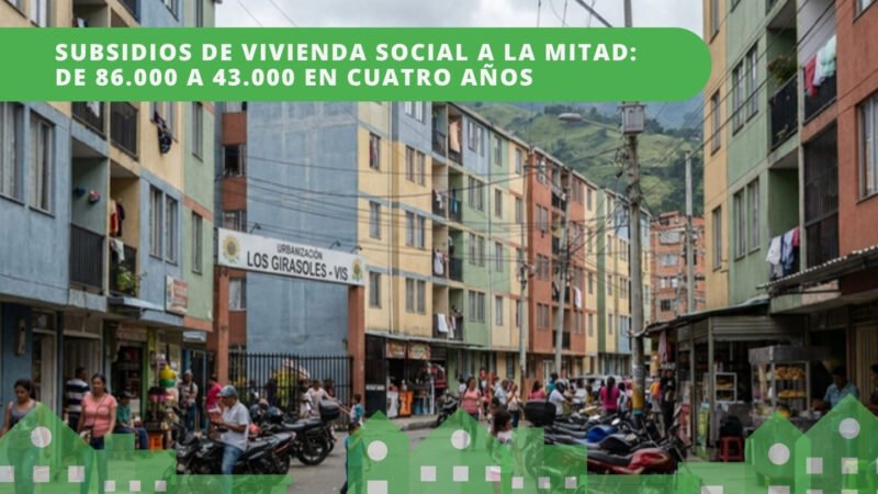 Urbanización de vivienda de interés social VIS en Colombia con edificios coloridos y residentes en la calle — subsidios 2025